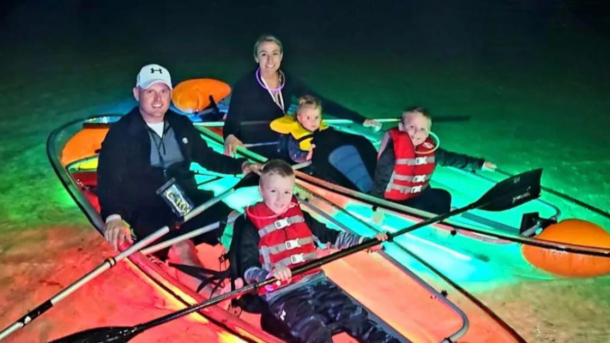 a person riding on the back of a boat