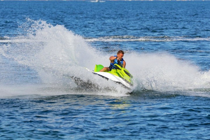 a man riding a wave on a surfboard in the water
