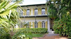 a palm tree in front of Ernest Hemingway House